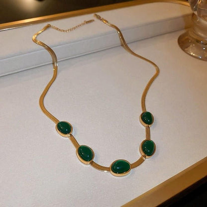 Halskettenset mit ovalem grünem Kristallanhänger und Armband